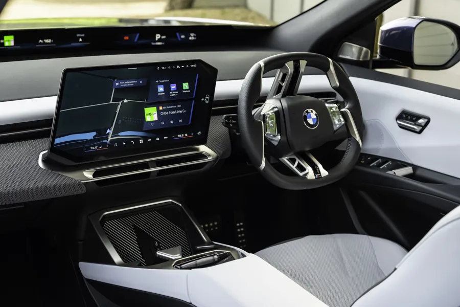 BMW iX3 interior with curved display and light upholstery