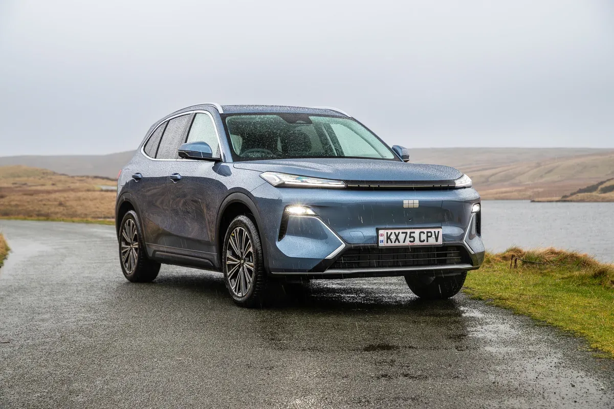 Blue Geely Starray EM-i Super Hybrid on a moorland road