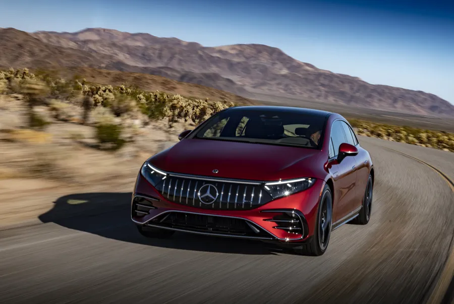 Mercedes-Benz EQS electric saloon in red on a desert road
