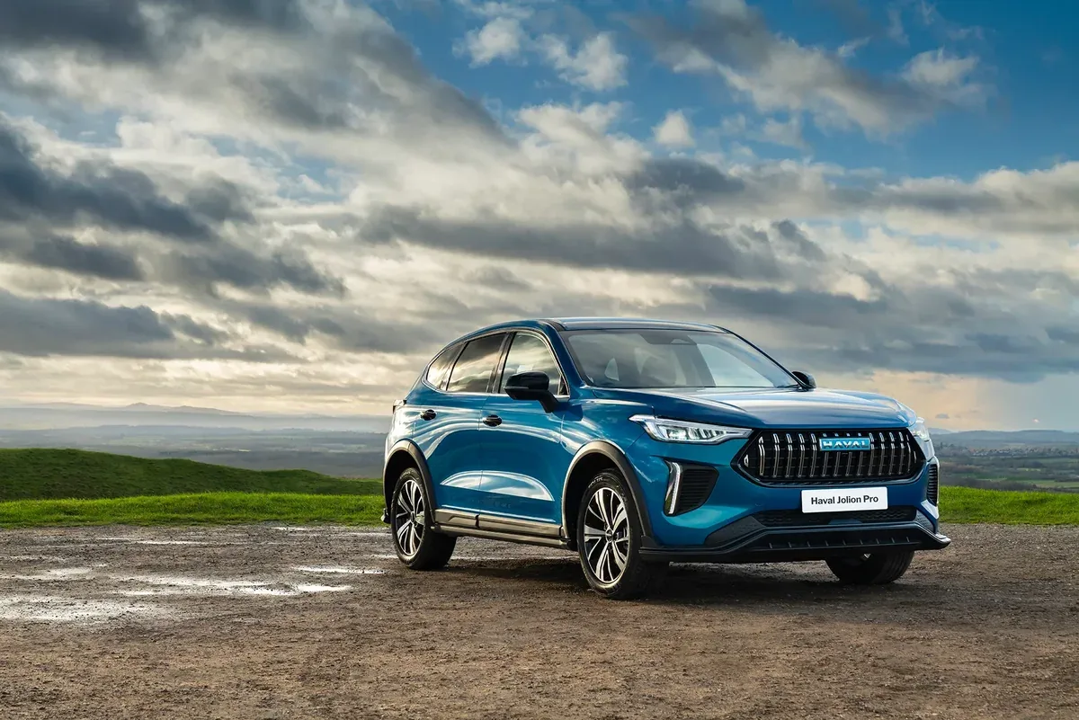 Blue GWM Haval Jolion Pro Hybrid parked on a mountain viewpoint