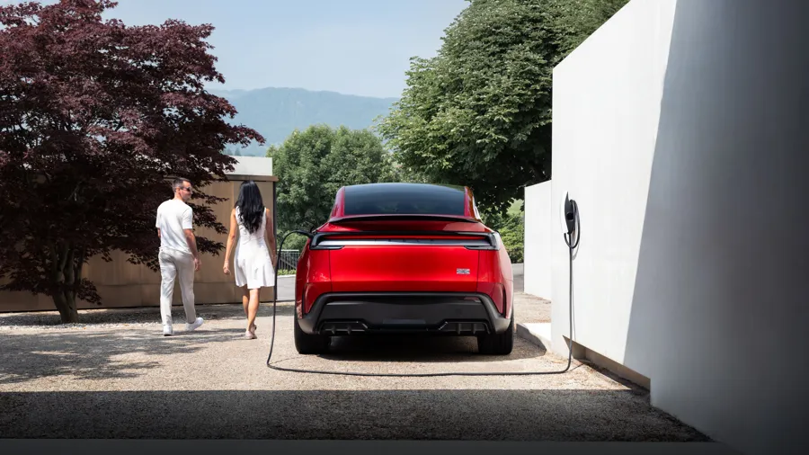 Electric car charging from a home wall charger on a domestic driveway