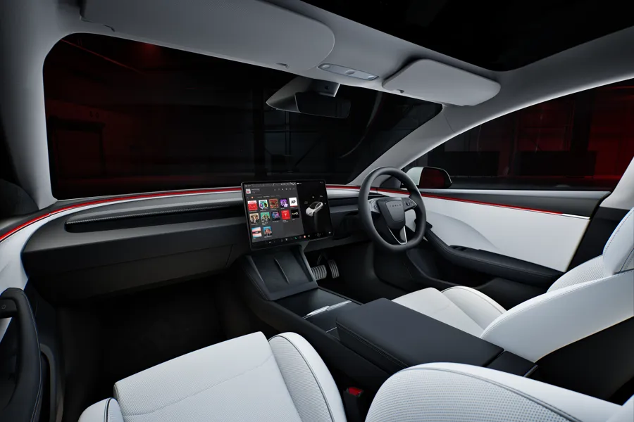 Electric car interior with central touchscreen and clean modern cabin